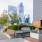 a rooftop deck overlooking a skyline